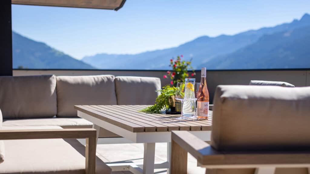 Penthouse terrace glacier view lounge furniture Kitzsteinhorn mountain view